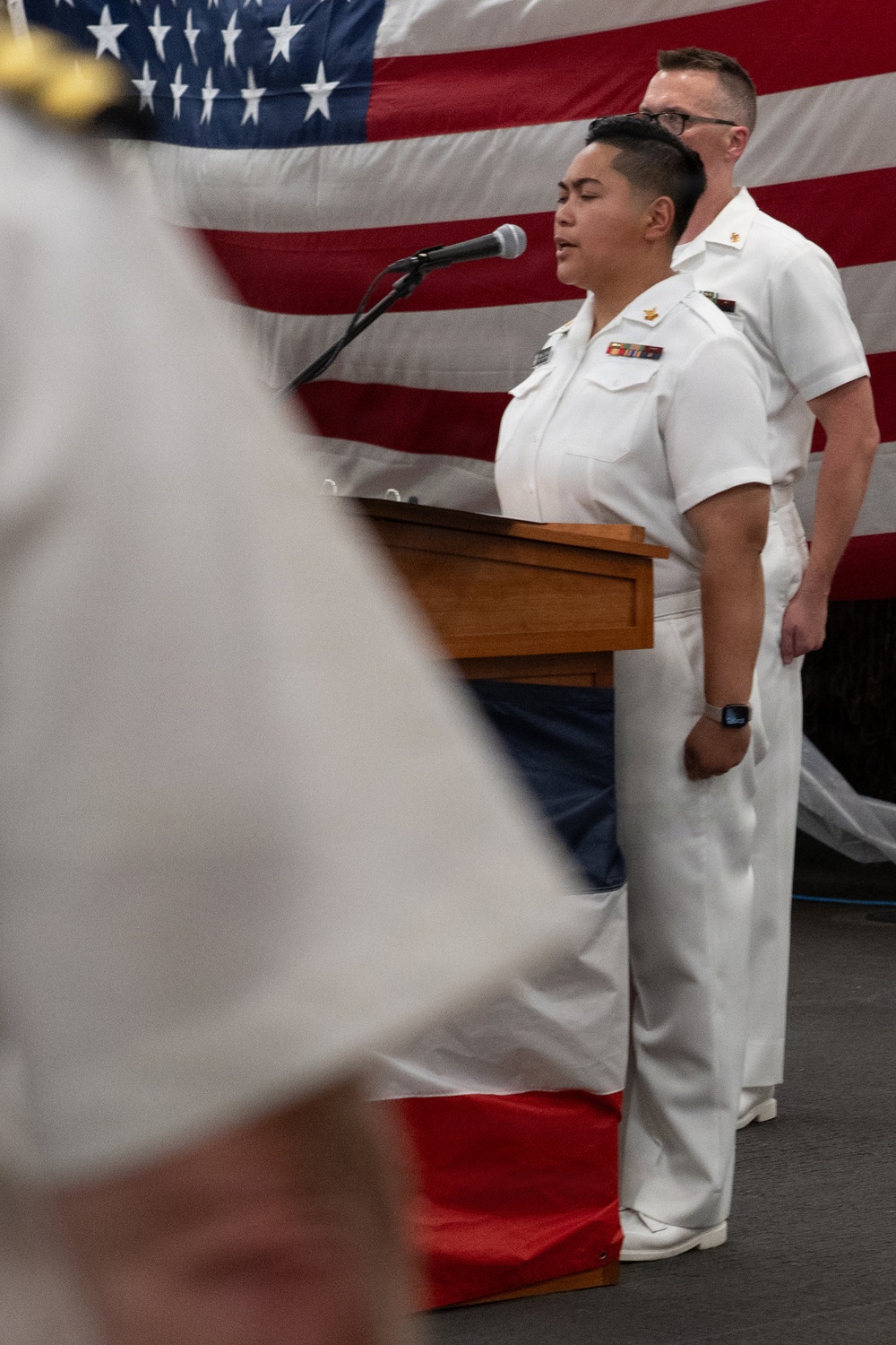 Musician 1st Class Danlie Cuenca performs the National Anthem at the International Naval Review Welcome Ceremony