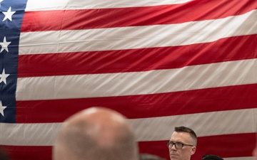Musician 1st Class Danlie Cuenca performs the National Anthem at the International Naval Review Welcome Ceremony