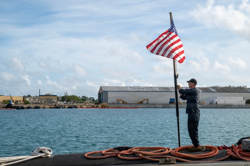 Retired U.S. Navy Cmdr. Allan Rigggs participates in morning colors aboard USS Annapolis