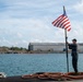 Retired U.S. Navy Cmdr. Allan Rigggs participates in morning colors aboard USS Annapolis