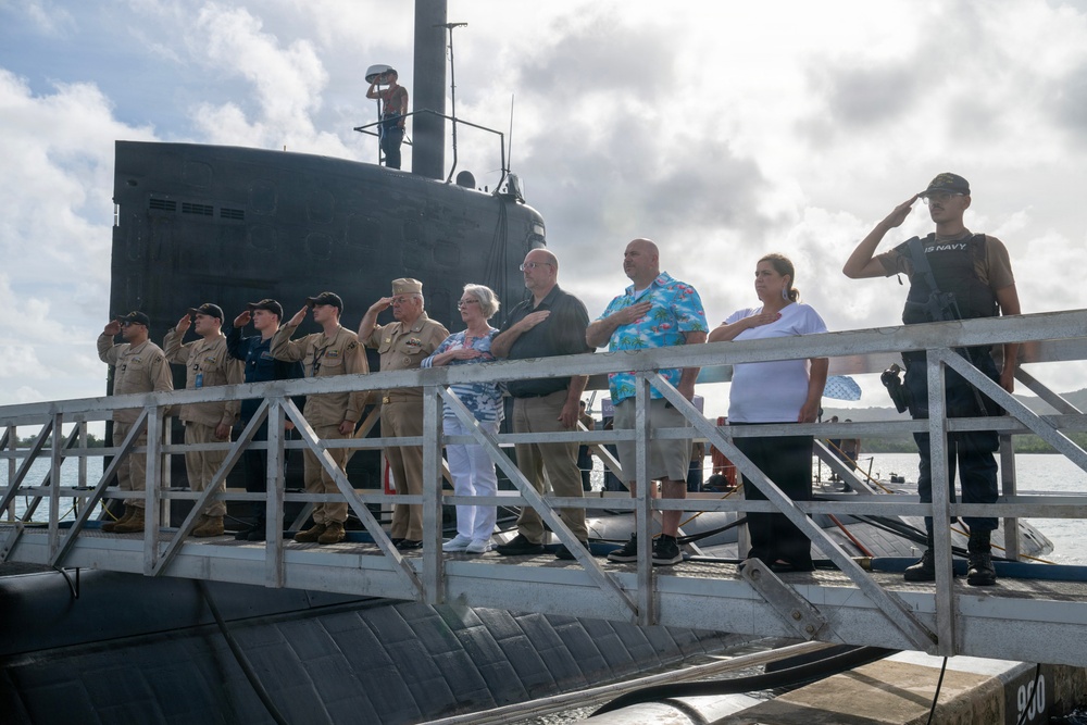 Retired U.S. Navy Cmdr. Allan Rigggs participates in morning colors aboard USS Annapolis