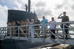 Retired U.S. Navy Cmdr. Allan Rigggs participates in morning colors aboard USS Annapolis