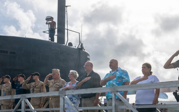 Retired U.S. Navy Cmdr. Allan Rigggs participates in morning colors aboard USS Annapolis