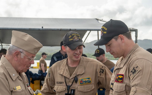 Retired U.S. Navy Cmdr. Allan Rigggs participates in morning colors aboard USS Annapolis
