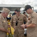 Retired U.S. Navy Cmdr. Allan Rigggs participates in morning colors aboard USS Annapolis