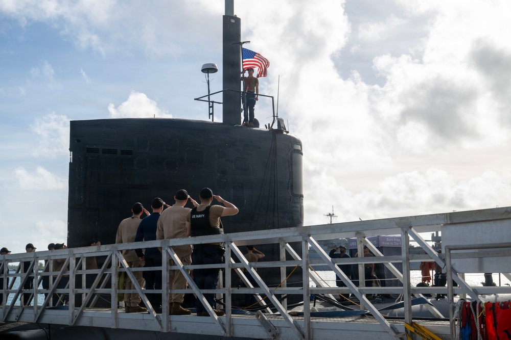 Retired U.S. Navy Cmdr. Allan Rigggs participates in morning colors aboard USS Annapolis
