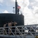 Retired U.S. Navy Cmdr. Allan Rigggs participates in morning colors aboard USS Annapolis