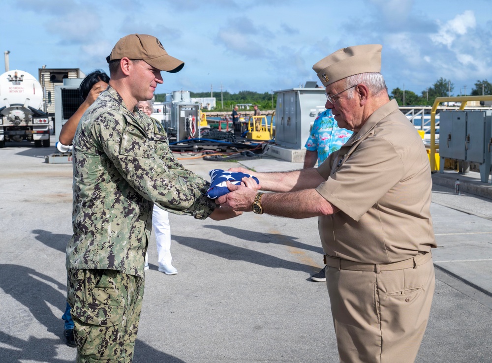 Retired U.S. Navy Cmdr. Allan Rigggs participates in morning colors aboard USS Annapolis