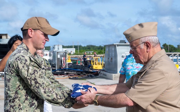 Retired U.S. Navy Cmdr. Allan Rigggs participates in morning colors aboard USS Annapolis