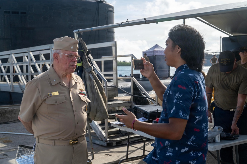 Retired U.S. Navy Cmdr. Allan Rigggs participates in morning colors aboard USS Annapolis