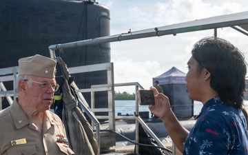 Retired U.S. Navy Cmdr. Allan Rigggs participates in morning colors aboard USS Annapolis