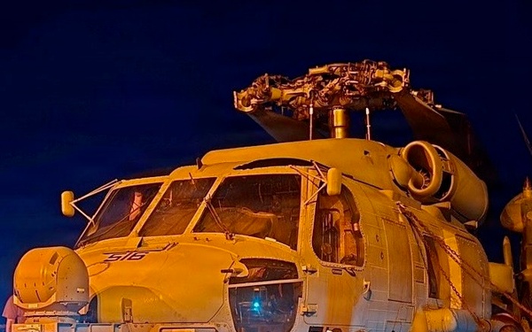 Sailors secure an MH-60R Seahawk helicopter, assigned to Helicopter Maritime Strike Squadron (HSM) 48.