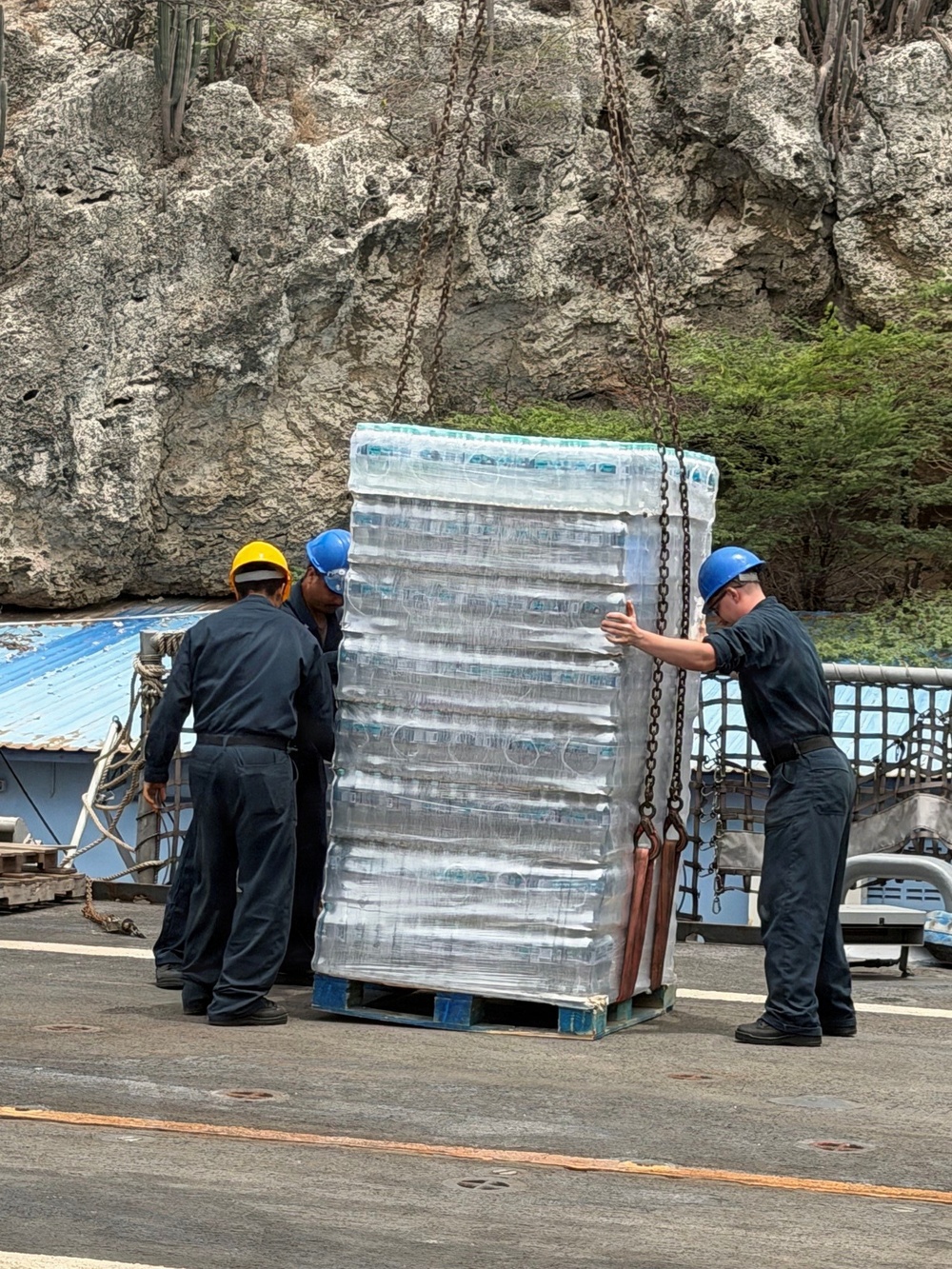 U.S. Navy Sailors load water donated by the Netherlands aboard the littoral combat ship USS Billings (LCS 15) while moored in Willemstad, Curacao, July 3, 2026.