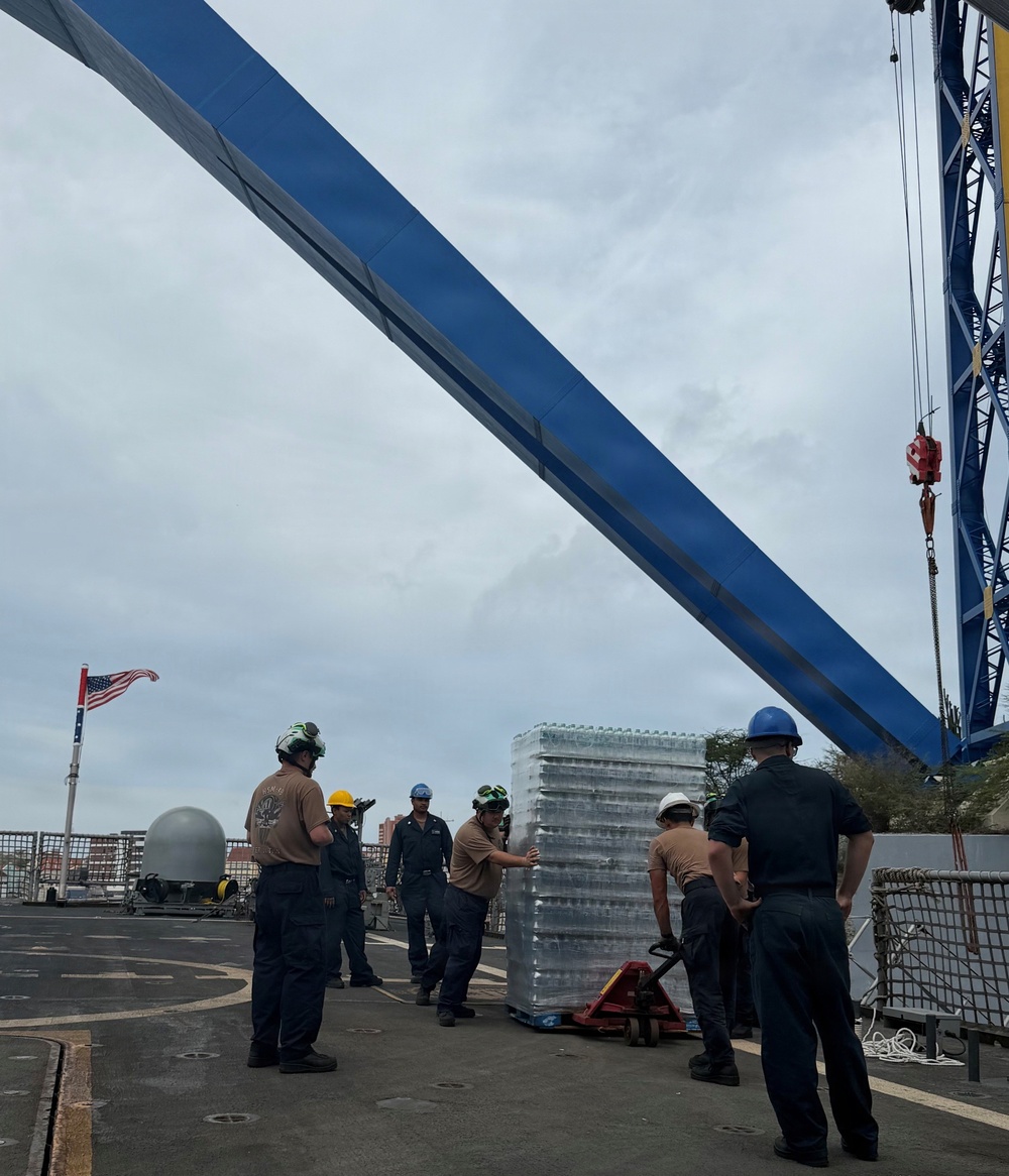 U.S. Navy Sailors load water donated by the Netherlands aboard the littoral combat ship USS Billings (LCS 15) while moored in Willemstad, Curacao, July 3, 2026.
