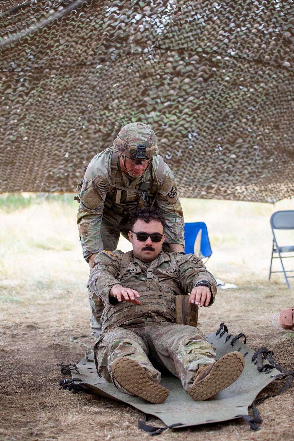 Army National Guard Soldier completes medical lane during Expert Soldier Badge assessment