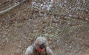 Army National Guard Soldier completes medical lane during Expert Soldier Badge assessment