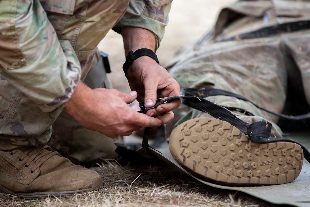 Army National Guard Soldier completes medical lane during Expert Soldier Badge assessment