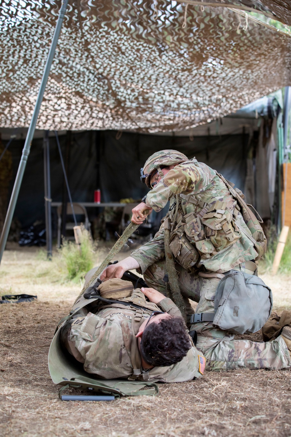 Army National Guard Soldier completes medical lane during Expert Soldier Badge assessment