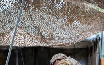 Army National Guard Soldier completes medical lane during Expert Soldier Badge assessment