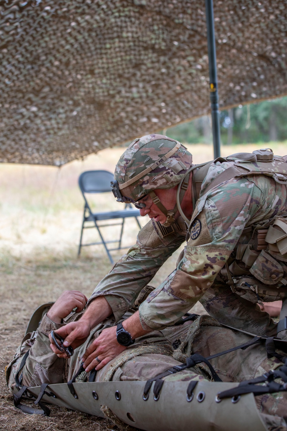 Army National Guard Soldier completes medical lane during Expert Soldier Badge assessment