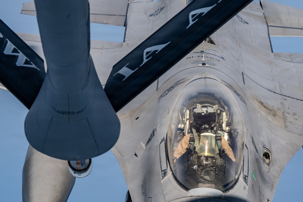 KC-135 refuels F16s for regional security