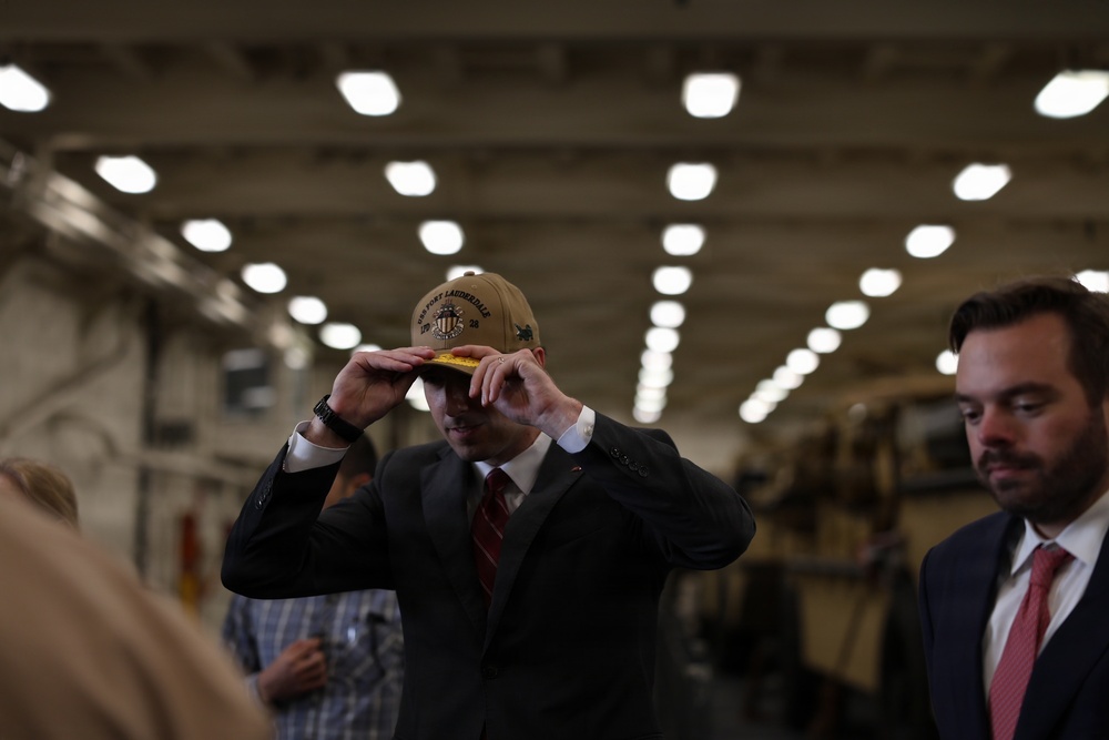 Mr. Caleb Orr, Assistant Secretary of State for Economic, Energy, and Business Affairs (EEB), receives a command ball cap.