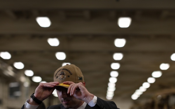 Mr. Caleb Orr, Assistant Secretary of State for Economic, Energy, and Business Affairs (EEB), receives a command ball cap.