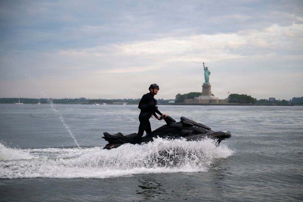 Coast Guard personal watercraft operates near Statue of Liberty during Sail 250