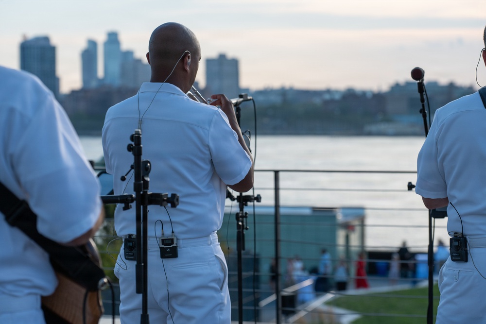 U.S. Navy Band Cruisers perform on Pier 57 at the United Nations fireworks viewing party.