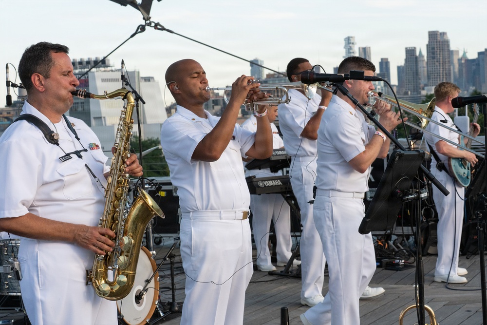 U.S. Navy Band Cruisers perform on Pier 57 at the United Nations fireworks viewing party.