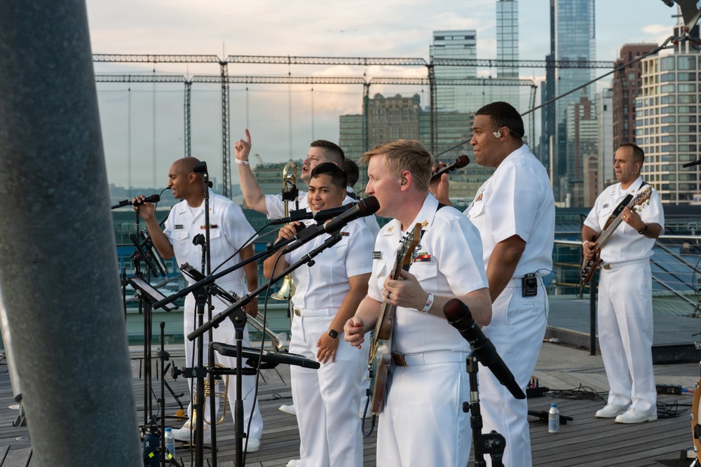 U.S. Navy Band Cruisers perform on Pier 57 at the United Nations fireworks viewing party.