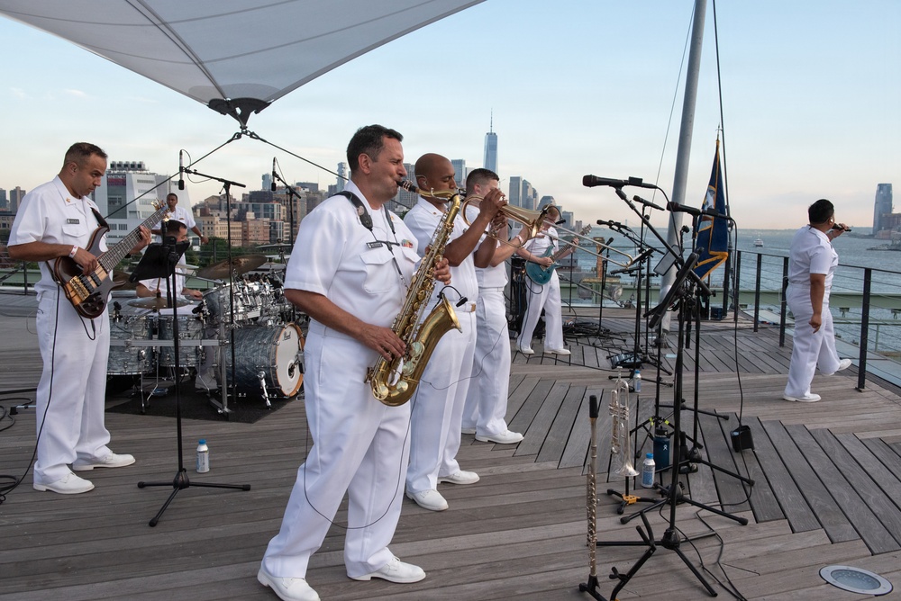 U.S. Navy Band Cruisers perform on Pier 57 at the United Nations fireworks viewing party.