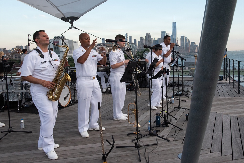 U.S. Navy Band Cruisers perform on Pier 57 at the United Nations fireworks viewing party.