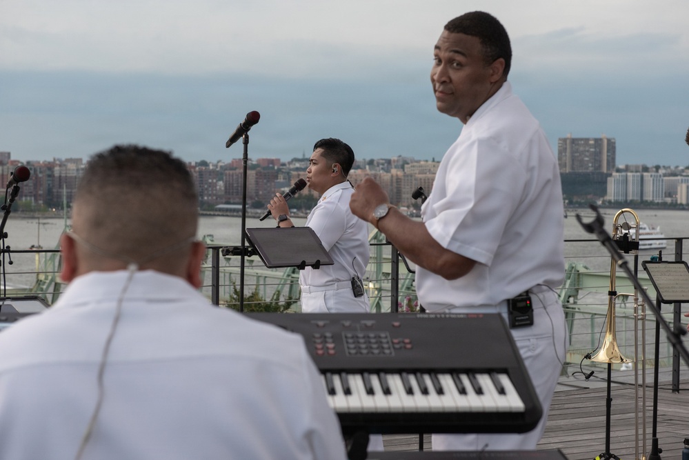 U.S. Navy Band Cruisers perform on Pier 57 at the United Nations fireworks viewing party.