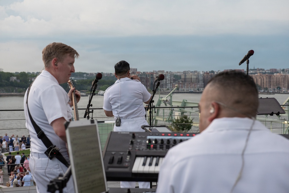 U.S. Navy Band Cruisers perform on Pier 57 at the United Nations fireworks viewing party.