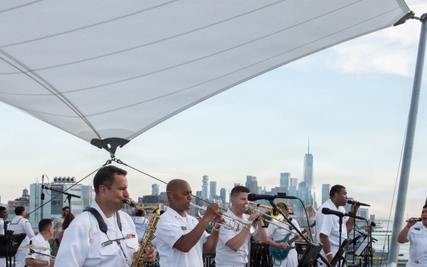 U.S. Navy Band Cruisers perform on Pier 57 at the United Nations fireworks viewing party.