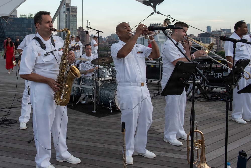 U.S. Navy Band Cruisers perform on Pier 57 at the United Nations fireworks viewing party.