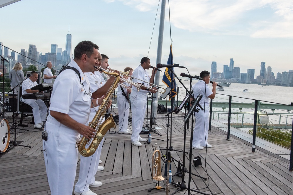 U.S. Navy Band Cruisers perform on Pier 57 at the United Nations fireworks viewing party.