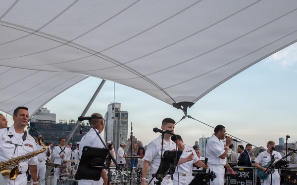 U.S. Navy Band Cruisers perform on Pier 57 at the United Nations fireworks viewing party.