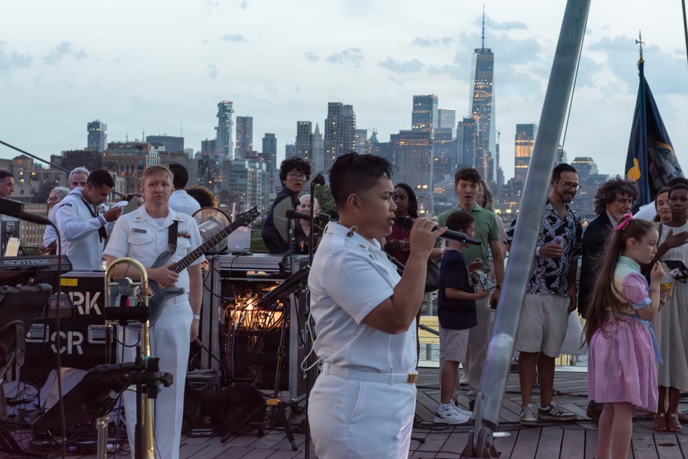 U.S. Navy Band Cruisers perform on Pier 57 at the United Nations fireworks viewing party.