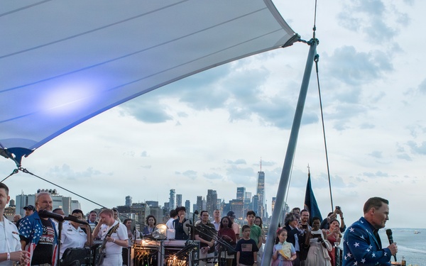 U.S. Navy Band Cruisers perform on Pier 57 at the United Nations fireworks viewing party.