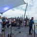 U.S. Navy Band Cruisers perform on Pier 57 at the United Nations fireworks viewing party.