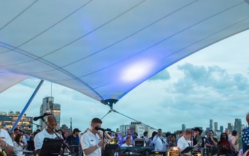 U.S. Navy Band Cruisers perform on Pier 57 at the United Nations fireworks viewing party.