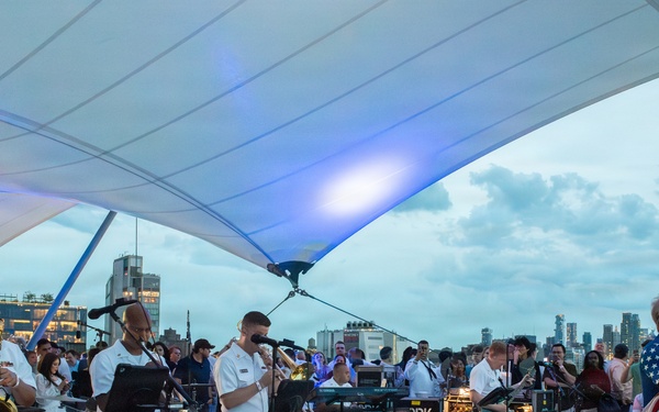 U.S. Navy Band Cruisers perform on Pier 57 at the United Nations fireworks viewing party.