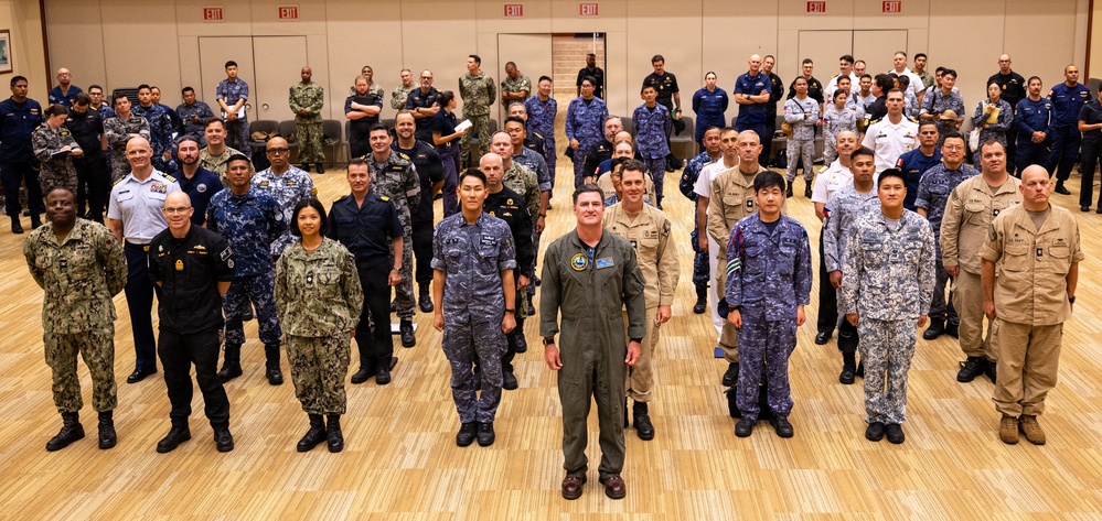 RIMPAC 2026 participants pose for photo during PHOTOEX brief for RIMPAC 2026