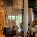 U.S. Coast Guard members view an exhibit inside the Statue of Liberty Museum