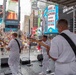 U.S. Navy Band Cruisers perform on Times Square for the International Naval Review.