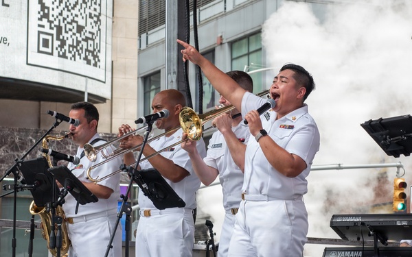 U.S. Navy Band Cruisers perform on Times Square for the International Naval Review.