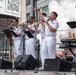 U.S. Navy Band Cruisers perform on Times Square for the International Naval Review.
