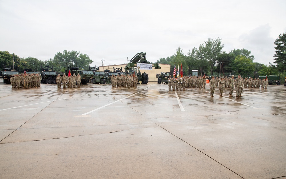 Soldiers of the 25th Transportation Battalion stand in formation for the Change of Command Ceremony at their motor pool.
